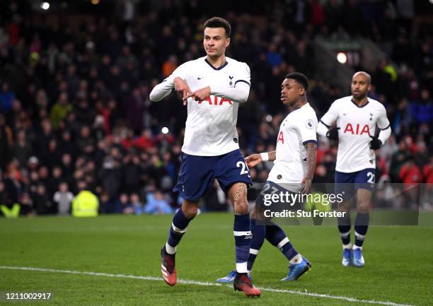 Dele Alli of Tottenham Hotspur celebrates after scoring his team's first goal from the penalty spot during the Premier League match between Burnley...