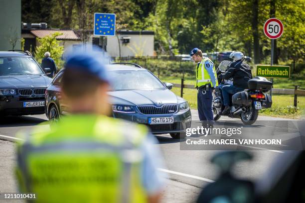 Members of the Dutch Military police carry out checks at the border with Germany in Vlodrop, The Netherlands, on April 25 as Germans want to go to...