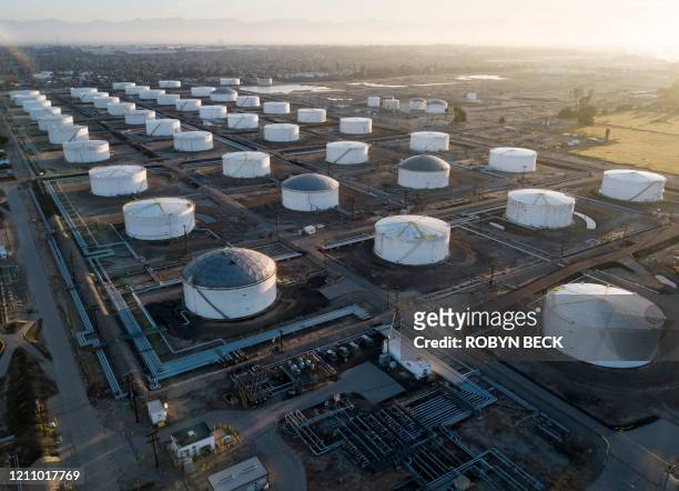 Oil-storage tanks are seen from above in Carson, California, April 25, 2020 after the price for crude plunged into negative territory for the first...