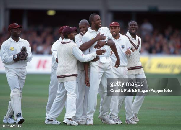 West Indies fast bowler Courtney Walsh celebrates after dismissing England batsman Mike Atherton , LBW for 45, during the 2nd Test match between...