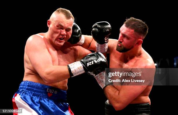 Hughie Fury knocks down Pavel Sour during the Heavyweight fight between Hughie Fury and Pavel Sour at Manchester Arena on March 07, 2020 in...