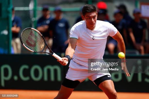 Gerardo Lopez Villaseñor of Mexico returns the ball during the fourth match as part of day 2 of Davis Cup World Group I Play-offs at Club Deportivo...