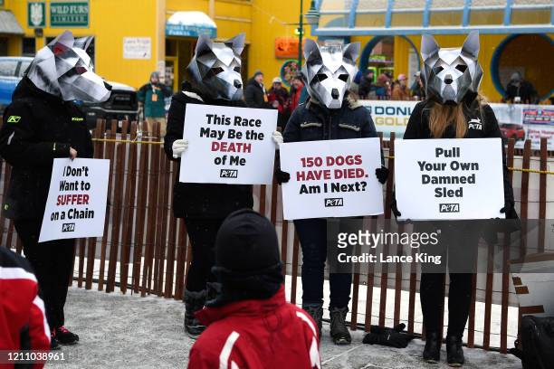 Activists of the animal rights organization PETA protest against the use of dogs in racing ahead of the ceremonial start of the 2020 Iditarod Sled...