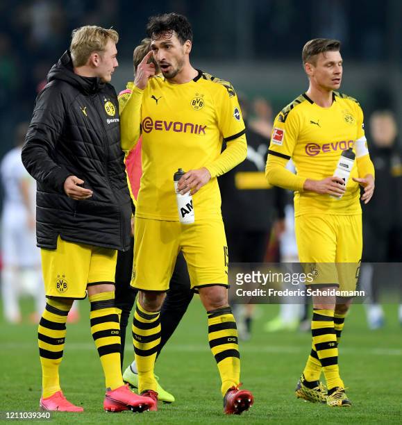 Dortmund's Julian Brandt, Dortmund's Mats Hummels and Dortmund's Lukasz Piszczek after the Bundesliga match between Borussia Moenchengladbach and...
