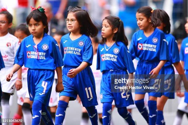 Girls wearing Cruz Azul uniforms enter the field during the 9th round match between Cruz Azul and Tijuana as part of the Torneo Clausura 2020 Liga MX...