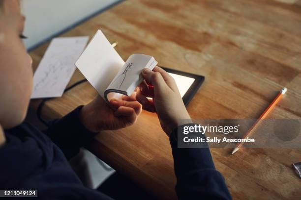 child drawing, making a flip book - flip book stock pictures, royalty-free photos & images