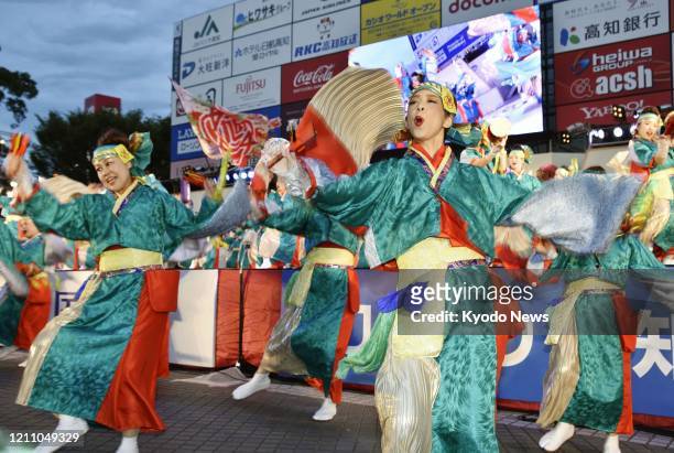 File photo taken Aug. 9 shows dancers performing at the Yosakoi dance festival in Kochi, western Japan. The annual summer festival, scheduled for...