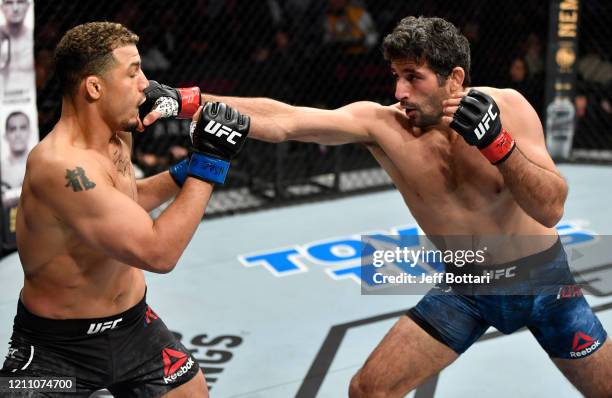 Beneil Dariush punches Drakkar Klose in their lightweight fight during the UFC 248 event at T-Mobile Arena on March 07, 2020 in Las Vegas, Nevada.
