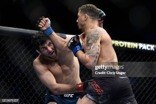 Beneil Dariush and Drakkar Klose trade punches in their lightweight fight during the UFC 248 event at T-Mobile Arena on March 07, 2020 in Las Vegas,...