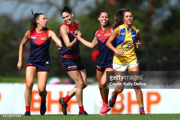 Kate Hore of the Demons and Tegan Cunningham of the Demons celebrate during the round five AFLW match between the Melbourne Demons and the West Coast...