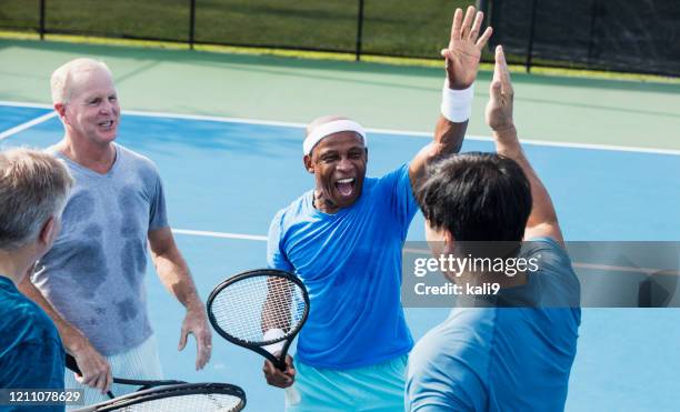 men playing tennis, high-five - senior tennis stock pictures, royalty-free photos & images