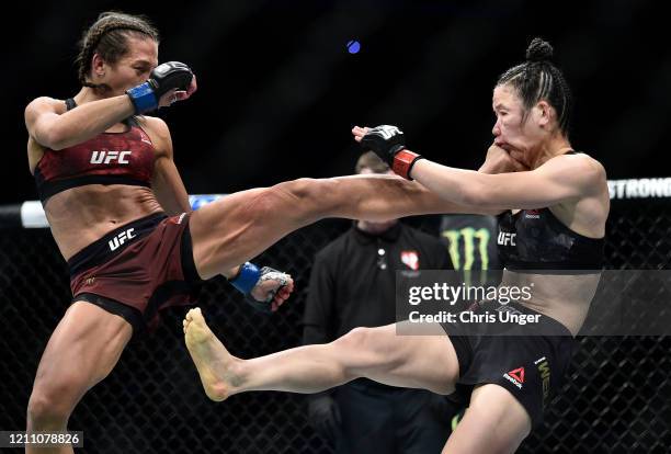 Joanna Jedrzejczyk of Poland kicks Zhang Weili of China in their UFC strawweight championship fight during the UFC 248 event at T-Mobile Arena on...