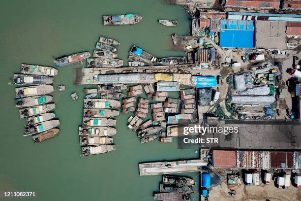 This aerial photo taken on April 27, 2020 shows fishing boats at a port in Lianyungang in China's eastern Jiangsu province, as they prepare for the...