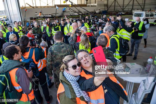 Andrea Tandler, an entrepreneur and daughter of former CSU politician Gerold Tandler takes a selfie as German Defense Minister Annegret...