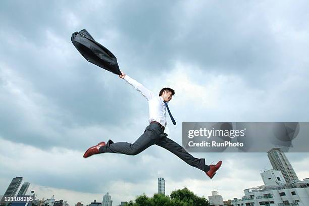 business man jumping in city - shirt and tie stock pictures, royalty-free photos & images