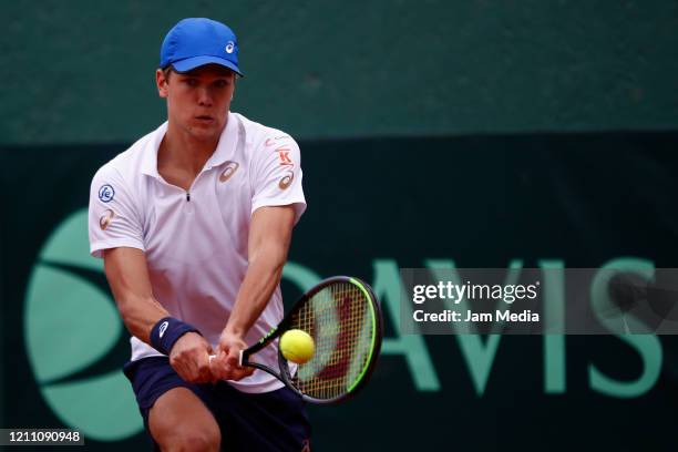 Otto Virtanen of Finland returns the ball as part of day 2 of Davis Cup World Group I Play-offs at Club Deportivo La Asuncion on March 7, 2020 in...