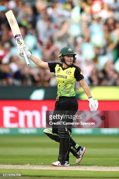 Alyssa Healy of Australia celebrates scoring a half century during the ICC Women's T20 Cricket World Cup Final match between India and Australia at...