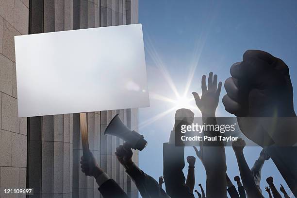 protest in front of building - giustizia sociale foto e immagini stock