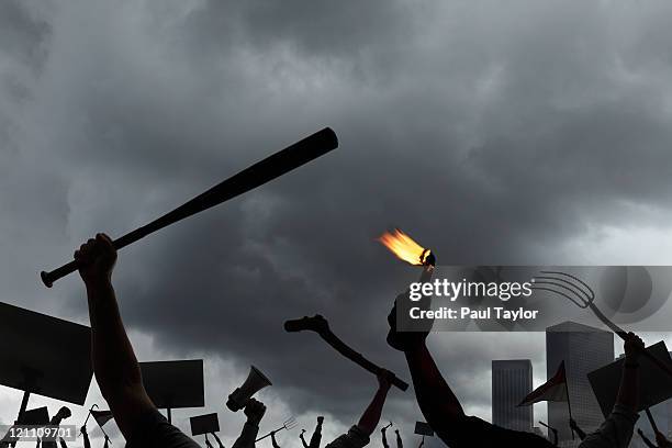 protest with city in background - manifestante fotografías e imágenes de stock