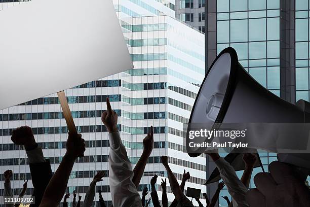 protest in city - protester sign stock pictures, royalty-free photos & images