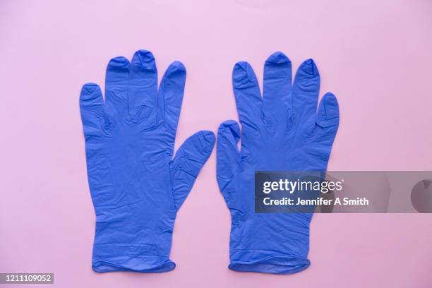surgical gloves - surgical glove stock pictures, royalty-free photos & images