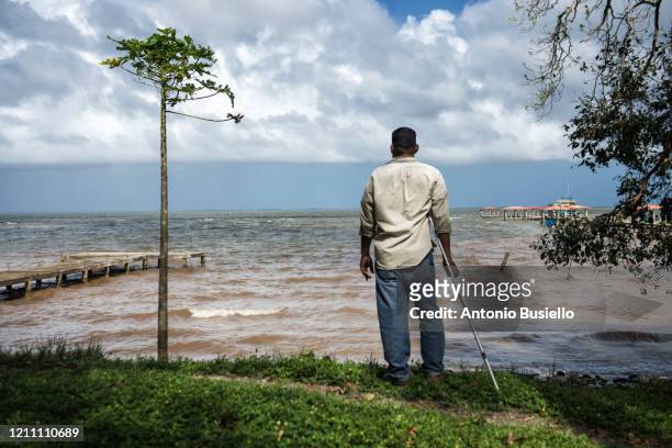 disable fisherman looking at the ocean, - decompression sickness stock pictures, royalty-free photos & images