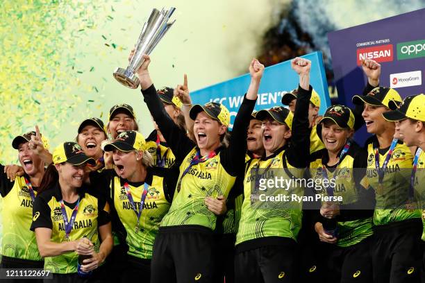 Meg Lanning of Australia holds aloft the championship trophy and celebrates with team mates after winning the ICC Women's T20 Cricket World Cup Final...