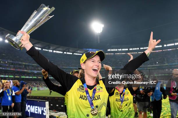 Meg Lanning of Australia holds aloft the championship trophy after winning the ICC Women's T20 Cricket World Cup Final match between India and...