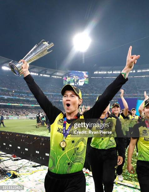 Meg Lanning of Australia celebrates with the World Cup Trophy during the ICC Women's T20 Cricket World Cup Final match between India and Australia at...