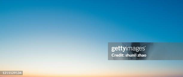 the gradual color of the sky at sunset - clear sky fotografías e imágenes de stock