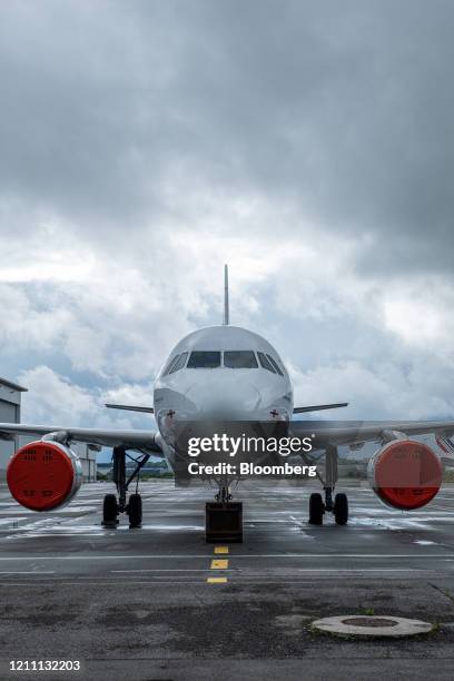 Protective covers sit on the engines of a passenger plane, operated by Air France-KLM, as it stands grounded on the tarmac at Blagnac Airport in...