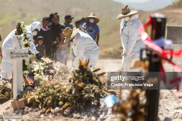 Cemetery workers dig a grave at Municipal cemetery Panteón número 13 on April 27, 2020 in Tijuana, Mexico. Baja California state remains as one of...