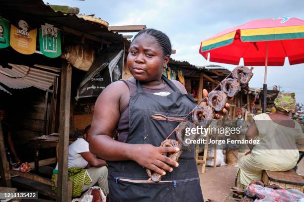 Woman selling dried fish at the Benin City market.