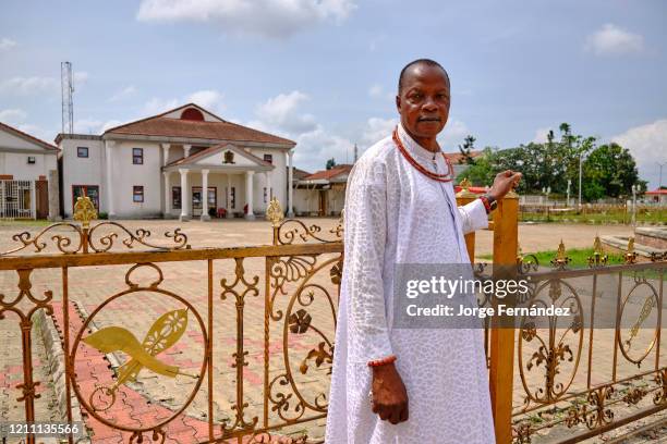 Portrait of an Edo nobleman in front of the Oba's palace in Benin City.