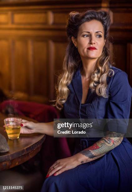 retro woman in a vintage public house scene - den bosch imagens e fotografias de stock