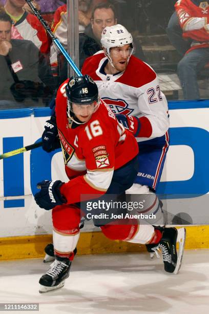 Dale Weise of the Montreal Canadiens and Aleksander Barkov of the Florida Panthers coe together along the boards at the BB&T Center on March 7, 2020...