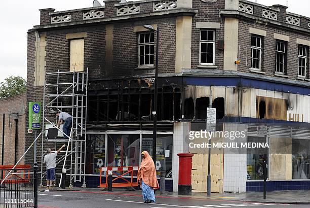 Building damaged by fire during riots is pictured on Tottenham High road in London, on August 11, 2011. After a relatively quiet night on London's...