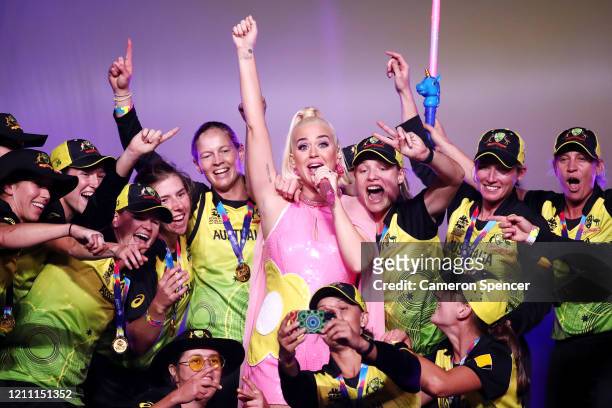 Katy Perry performs on stage with the Australian team during a concert after their victory in the ICC Women's T20 Cricket World Cup Final match...