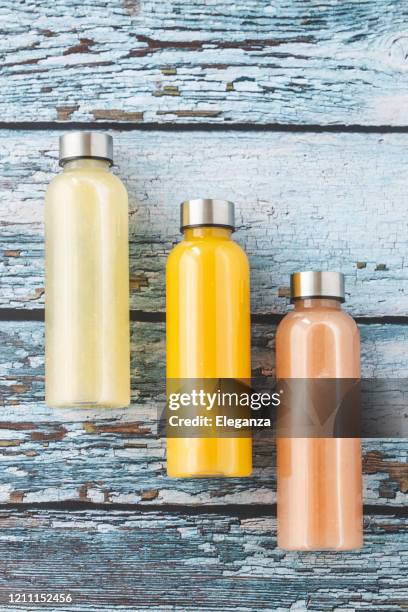 three bottles of smoothies - punching glass stock pictures, royalty-free photos & images