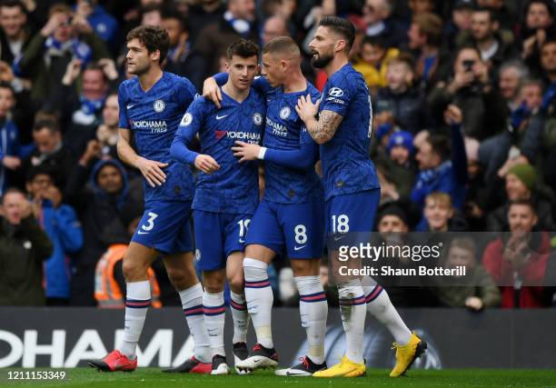 Mason Mount of Chelsea celebrates with teammates after scoring his team's first goal during the Premier League match between Chelsea FC and Everton...