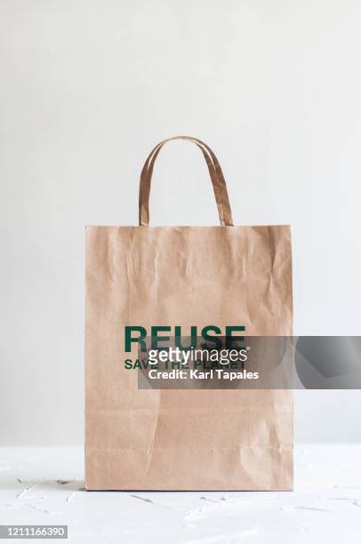 a still life of paper bag on a white background - grocery bag stock pictures, royalty-free photos & images
