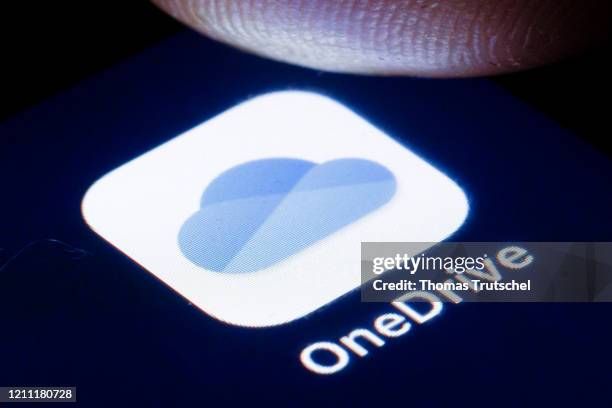 The logo of the Microsoft OneDrive cloud storage service is shown on the display of a smartphone on April 22, 2020 in Berlin, Germany.