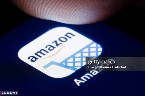 The logo of the online retailer Amazon is shown on the display of a smartphone on April 22, 2020 in Berlin, Germany.