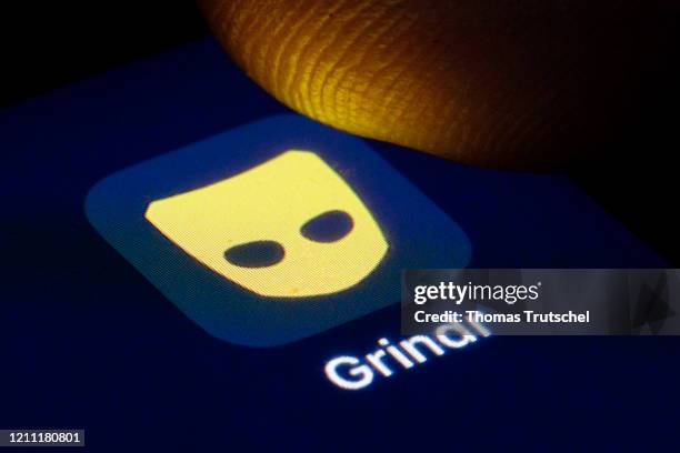 The logo of the dating app for gay and bisexual men Grindr is shown on the display of a smartphone on April 22, 2020 in Berlin, Germany.