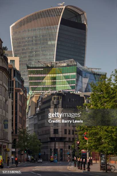 Plantation House in Green is dwarfed bt the Walkie Talkie building seen from a deserted Aldgate at rush hour during the coronavirus pandemic on the...