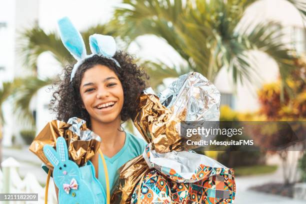 portrait of young teenage girl celebrating easter - bunny eggs stock pictures, royalty-free photos & images