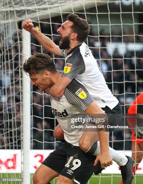 Chris Martin of Derby County celebrates with Graeme Shinnie after scoring their third goal from the penalty spot during the Sky Bet Championship...