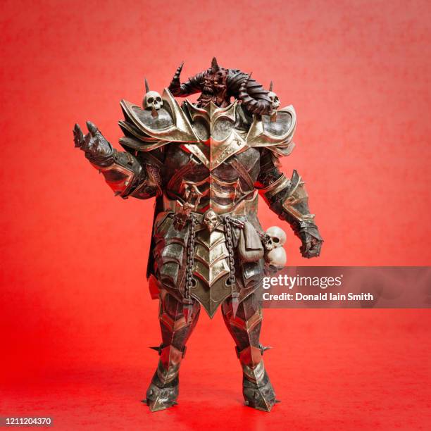 fantasy figure in medieval armour with skulls - evil warrior stock pictures, royalty-free photos & images