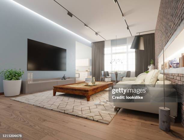 modern living room - wall of tvs stock pictures, royalty-free photos & images