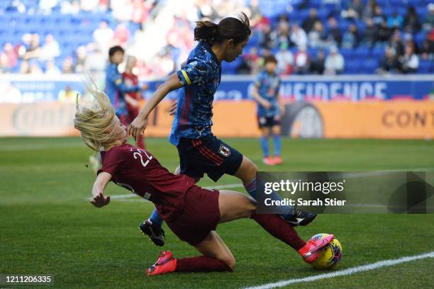 Emi Nakajima of Japan attempts to steal the ball away from Chloe Kelly of England during the second half in the SheBelieves Cup at Red Bull Arena on...